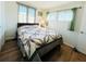 Bright bedroom with wood floors and a comfortable bed at 3214 Pink Oak Ter, Sarasota, FL 34237