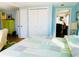 Bedroom with king bed and view into living room at 3214 Pink Oak Ter, Sarasota, FL 34237