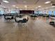 Large community hall with numerous tables and chairs, perfect for events at 3214 Pink Oak Ter, Sarasota, FL 34237