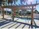 Relaxing hot tub with pergola cover at 3214 Pink Oak Ter, Sarasota, FL 34237