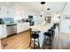 Spacious kitchen with island, stainless steel appliances, and light wood flooring at 3214 Pink Oak Ter, Sarasota, FL 34237