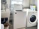 Laundry room with washer, dryer, and utility sink at 3214 Pink Oak Ter, Sarasota, FL 34237