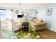 Cozy living room featuring a sofa and recliner at 3214 Pink Oak Ter, Sarasota, FL 34237