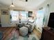 Living room with comfy seating and large windows at 3214 Pink Oak Ter, Sarasota, FL 34237