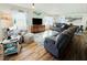 Spacious living room with two sofas and a large TV at 3214 Pink Oak Ter, Sarasota, FL 34237