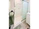 Clean shower with sliding glass doors and built-in shelving at 3214 Pink Oak Ter, Sarasota, FL 34237