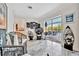 Sunroom with wicker chairs, view of the pool and kitchen at 3219 Dawson St, Sarasota, FL 34239