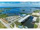 Aerial view of marina with covered boat slips and parking at 362 Pine Run Dr, Osprey, FL 34229
