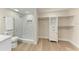 Modern bathroom with a shower, marble tile, and built-in storage at 362 Pine Run Dr, Osprey, FL 34229