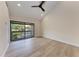 Spacious bedroom featuring a vaulted ceiling, light walls, and wood flooring at 362 Pine Run Dr, Osprey, FL 34229