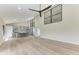 Bright living room with vaulted ceilings, hardwood floors, and sliding glass doors at 362 Pine Run Dr, Osprey, FL 34229
