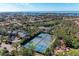 Aerial view of tennis courts and surrounding community at 362 Pine Run Dr, Osprey, FL 34229