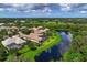 Luxury home with pool and lake views in a golf course community at 4022 Mayors Ct, Sarasota, FL 34240
