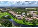 Aerial view of a single Gathering home with a pool, located in a quiet community at 4022 Mayors Ct, Sarasota, FL 34240