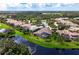 Aerial view showcasing a luxury home with pool and spa in a golf course community at 4022 Mayors Ct, Sarasota, FL 34240