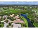 Luxury home with pool and lake views in a golf course community at 4022 Mayors Ct, Sarasota, FL 34240