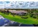 Luxury home with a large pool and screened lanai overlooking a tranquil lake at 4022 Mayors Ct, Sarasota, FL 34240