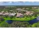 Aerial view of a luxury home with pool and spa, situated in a desirable neighborhood at 4022 Mayors Ct, Sarasota, FL 34240