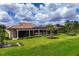 Peaceful backyard showcasing a pool and screened lanai, surrounded by lush landscaping at 4022 Mayors Ct, Sarasota, FL 34240