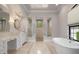Spa-like bathroom with soaking tub and walk-in showers at 4022 Mayors Ct, Sarasota, FL 34240