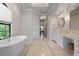 Spa-like bathroom featuring a large soaking tub and walk-in shower at 4022 Mayors Ct, Sarasota, FL 34240