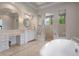 Luxurious bathroom with double vanity and soaking tub at 4022 Mayors Ct, Sarasota, FL 34240