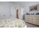 Guest bedroom with dresser and ensuite bathroom access at 4022 Mayors Ct, Sarasota, FL 34240