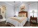 Bedroom with en-suite bathroom and wood floors at 4022 Mayors Ct, Sarasota, FL 34240