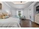 Spacious primary bedroom with sitting area and access to patio at 4022 Mayors Ct, Sarasota, FL 34240