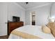 Bedroom with en-suite bathroom and wood floors at 4022 Mayors Ct, Sarasota, FL 34240