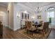 Formal dining room with chandelier and hardwood floors at 4022 Mayors Ct, Sarasota, FL 34240