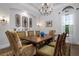 Formal dining room with chandelier and hardwood floors at 4022 Mayors Ct, Sarasota, FL 34240