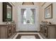 Bright entryway with double doors and decorative consoles at 4022 Mayors Ct, Sarasota, FL 34240