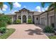 Stunning curb appeal, paver driveway, lush landscaping at 4022 Mayors Ct, Sarasota, FL 34240