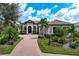 Beautiful home exterior with a large yard and palm trees at 4022 Mayors Ct, Sarasota, FL 34240