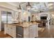Large kitchen island with granite countertops and stainless steel appliances at 4022 Mayors Ct, Sarasota, FL 34240