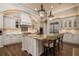 Open kitchen boasts granite island, custom cabinetry, and high-end appliances at 4022 Mayors Ct, Sarasota, FL 34240
