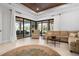Spacious living room with sliding glass doors opening to a relaxing outdoor patio at 4022 Mayors Ct, Sarasota, FL 34240