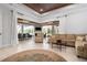 Spacious living room with sliding glass doors opening to a relaxing outdoor patio at 4022 Mayors Ct, Sarasota, FL 34240