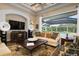 Living room with pool view and high-end entertainment system at 4022 Mayors Ct, Sarasota, FL 34240
