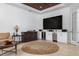Home theater with built-in cabinetry and wine cooler at 4022 Mayors Ct, Sarasota, FL 34240