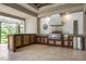 Gourmet outdoor kitchen with stainless steel appliances and custom cabinetry at 4022 Mayors Ct, Sarasota, FL 34240