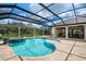 Stunning pool and spa with a covered patio and outdoor living space at 4022 Mayors Ct, Sarasota, FL 34240