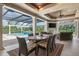 Relaxing pool area with covered patio and outdoor fireplace at 4022 Mayors Ct, Sarasota, FL 34240