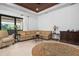 Comfortable sitting area with sectional sofa and area rug at 4022 Mayors Ct, Sarasota, FL 34240