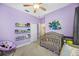 Bright Bedroom with crib, artwork, and plenty of storage at 4138 Deep Creek Ter, Parrish, FL 34219