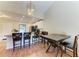 Bright kitchen and dining area with breakfast bar, modern appliances, and wood flooring at 428 40Th W Ct, Palmetto, FL 34221