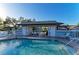 Refreshing community pool with shaded seating and tables at 428 40Th W Ct, Palmetto, FL 34221