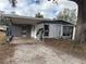 Front view of a ranch home with covered carport at 4435 56Th Avenue E Ter, Bradenton, FL 34203