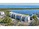 White building with waterfront views at 4500 Gulf Of Mexico Dr # 305, Longboat Key, FL 34228